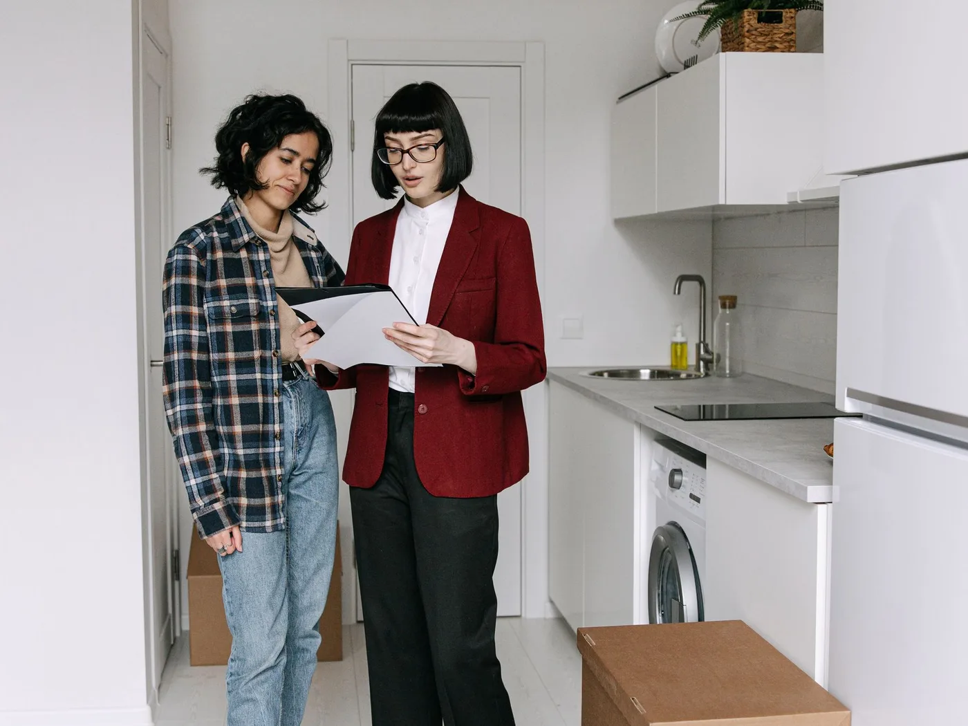 A home seller and real estate agent working together at a table